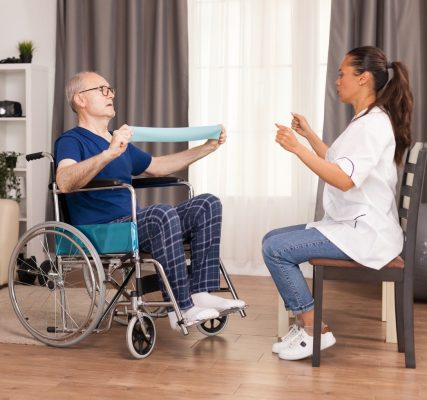 senior-man-with-disability-wheelchair-doing-recovery-exercise-with-resistance-band laynacares.co.uk